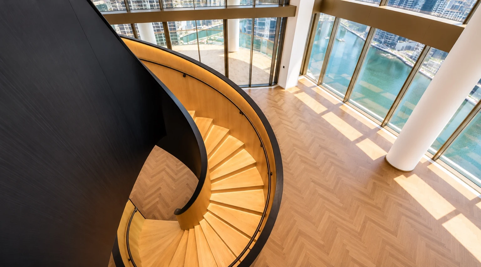Duplex staircase overlooking the living room